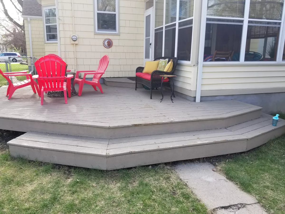 Weathered gray painted deck before restoration